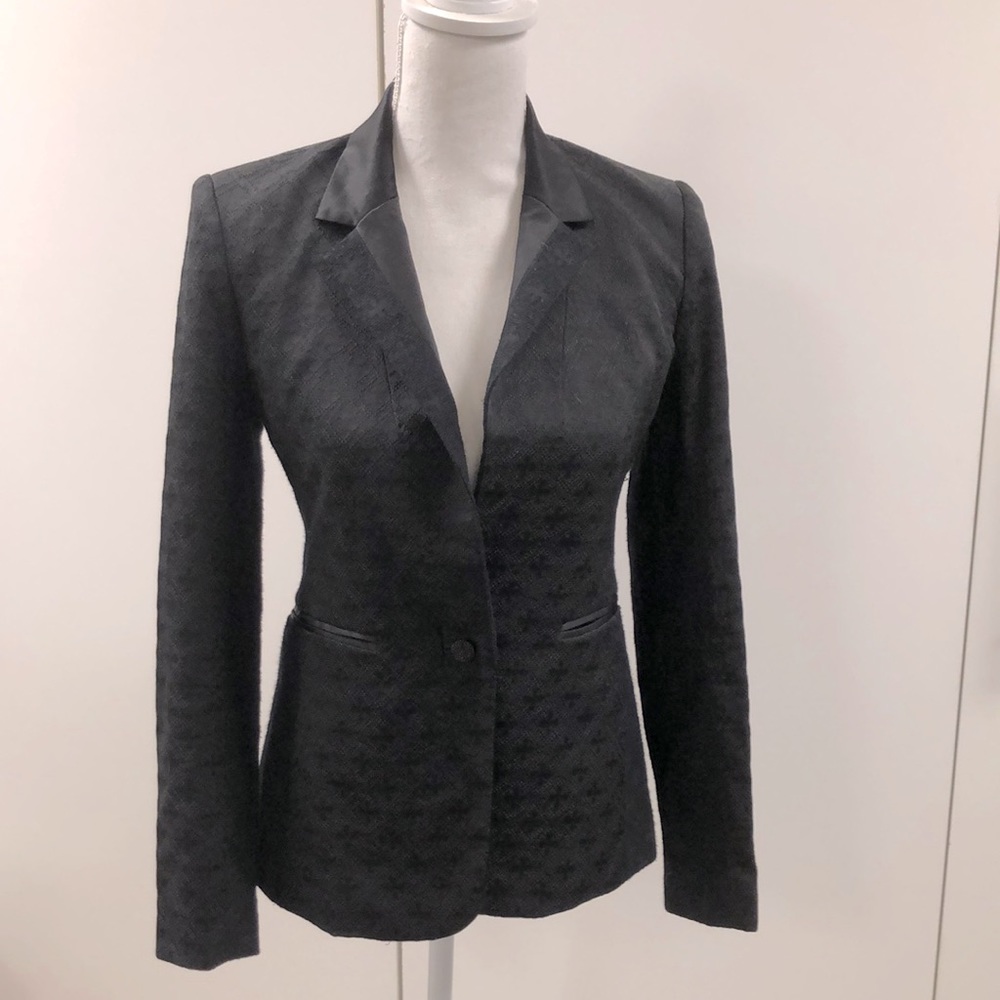Woman’s tuxedo jacket measuring 14” across the back from shoulder to shoulder